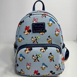 NWT. Disney Parks Loungefly Mickey and Friends Denim-style Mini Backpack bag